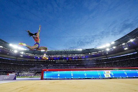 Tara Davis-Woodhall, of the United States, competes in the women's long jump final